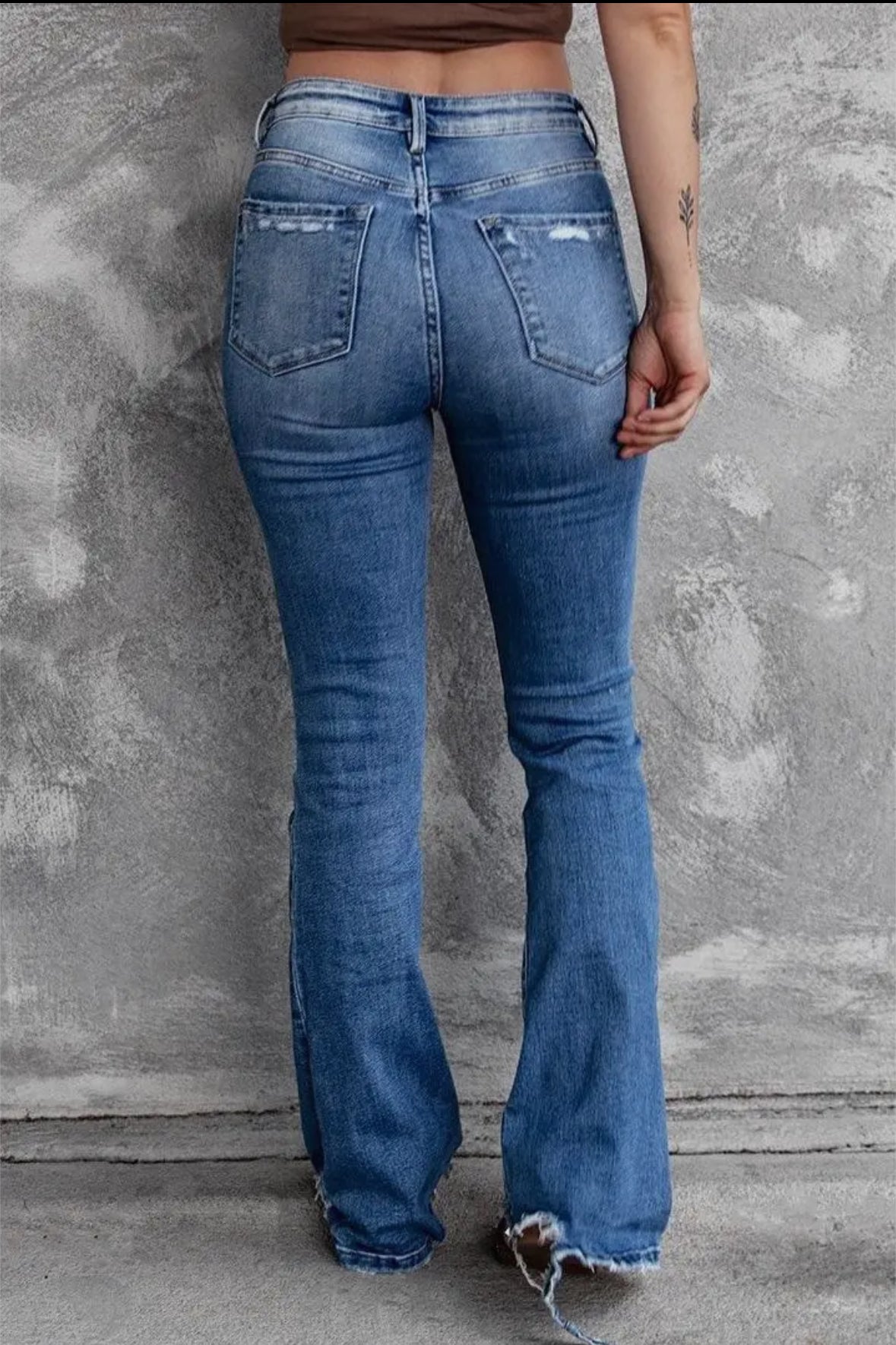 High-rise trousers stretch raw ripped jeans